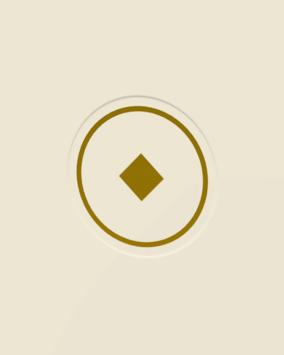 A gold foil ring on a disc pressed into a cream box.